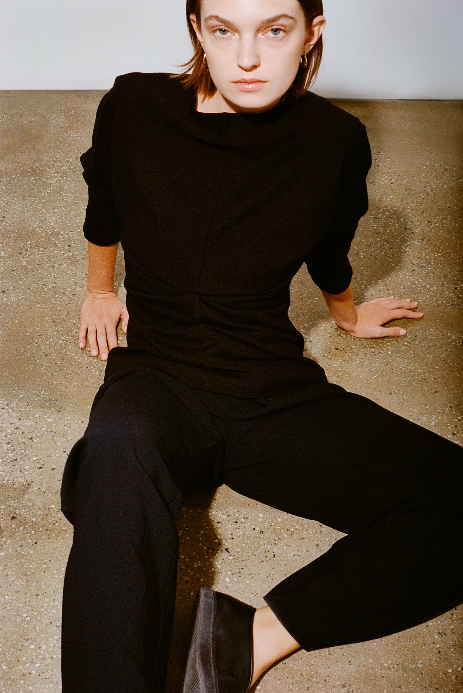 Women's pleated back batwing top in knit fabric, featuring oversized batwing sleeves and relaxed, flowy fit, elevated everyday top.