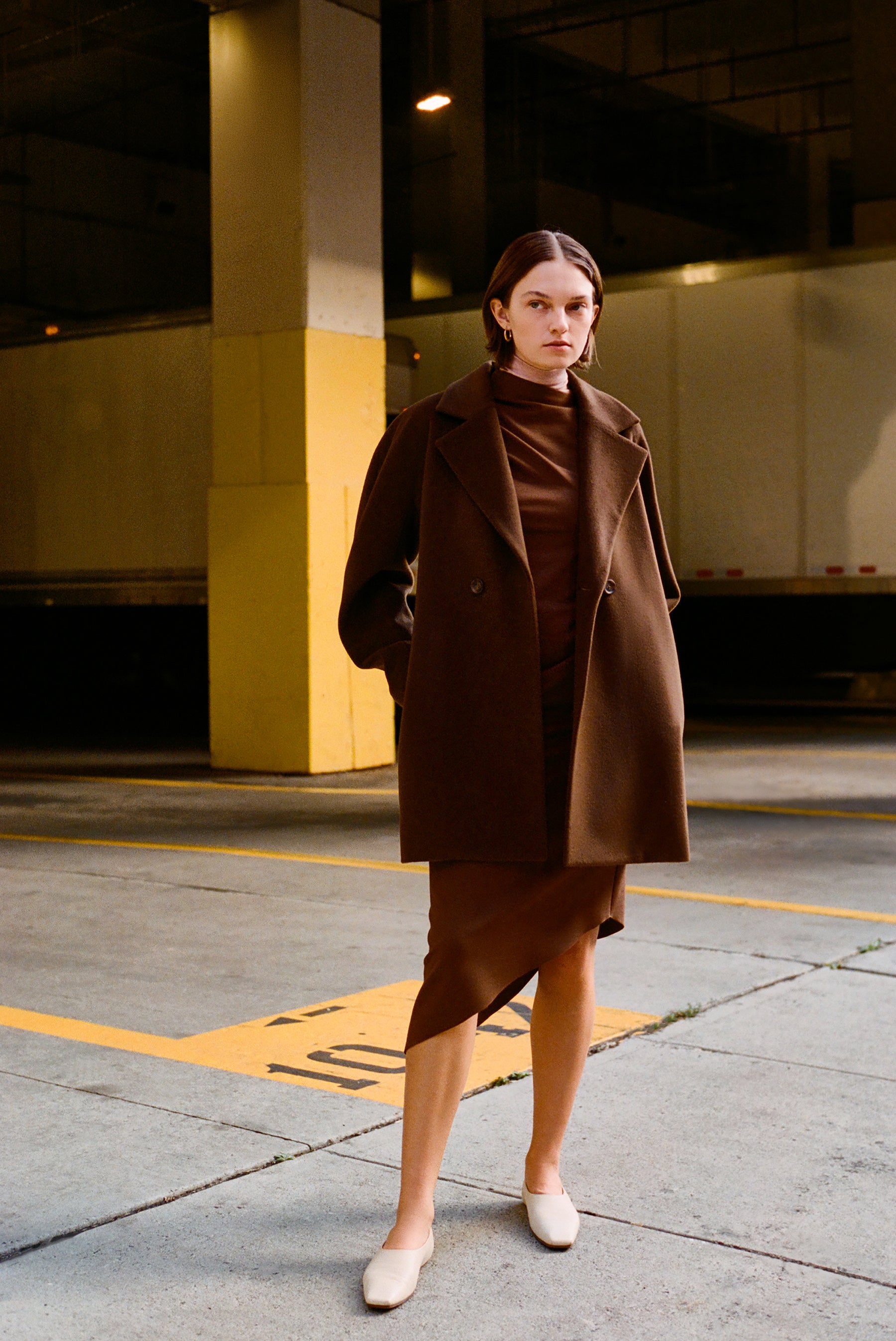Women's half coat in the softest plaited cashmere-wool blend with unique back detail, crafted in brown double-face fabric for a luxurious look and feel