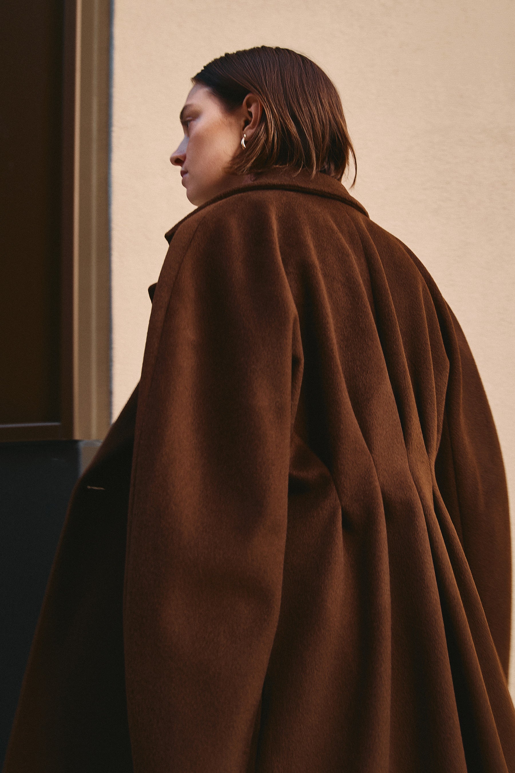 Women's half coat in the softest plaited cashmere-wool blend with unique back detail, crafted in brown double-face fabric for a luxurious look and feel